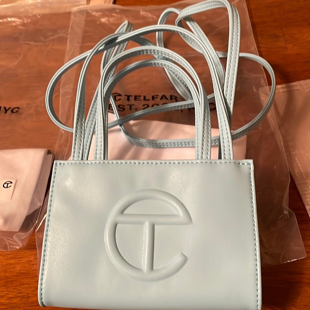 Gently used, Small pool blue Telfar shopping bag. Includes tag and bags.